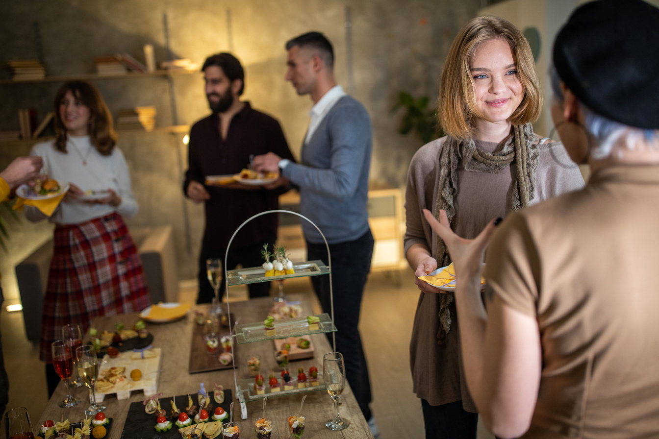 Business team bonding on after work dinner party at modern office